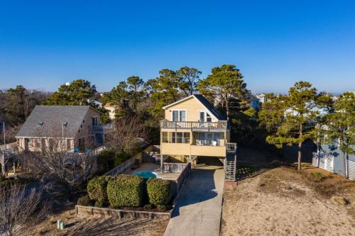 an aerial view of a house on a beach at A Shore Thing in Duck in Duck