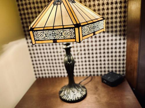 a lamp sitting on top of a table at Stylish 3BR with Patio Walk to State Capitol in Frankfort
