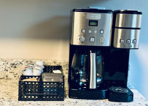 a coffee maker sitting on top of a counter at Stylish 3BR with Patio Walk to State Capitol in Frankfort