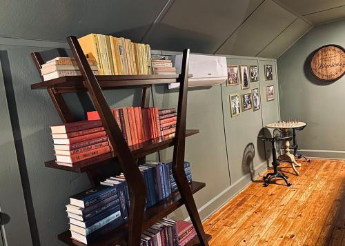 a room with a book shelf filled with books at Stylish 3BR with Patio Walk to State Capitol in Frankfort