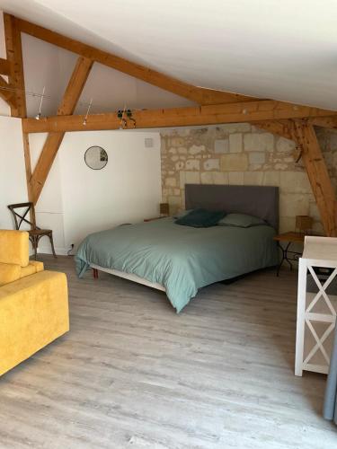 Ένα ή περισσότερα κρεβάτια σε δωμάτιο στο Charmante petite maison