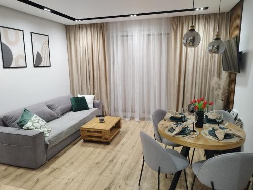 Χώρος καθιστικού στο Apartament z ogrodem Camelia