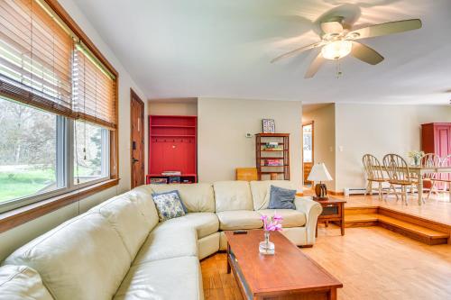 a living room with a couch and a table at 6 Mi to Beach Family Home in Little Compton! in Little Compton