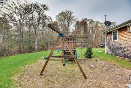a wooden swing set in a yard at 6 Mi to Beach Family Home in Little Compton! in Little Compton