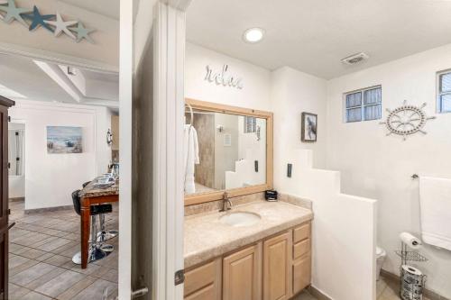 a bathroom with a sink and a mirror at Las Palmas 2BR 2BA Suite 3rd FL Ocean View- B301 in Campo del Medio
