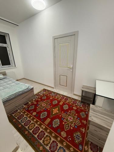 Ένα ή περισσότερα κρεβάτια σε δωμάτιο στο KAMIR Guest House