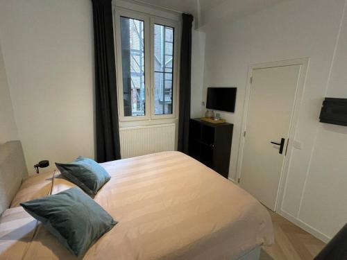 Ένα ή περισσότερα κρεβάτια σε δωμάτιο στο Stadsstudio Antwerpen