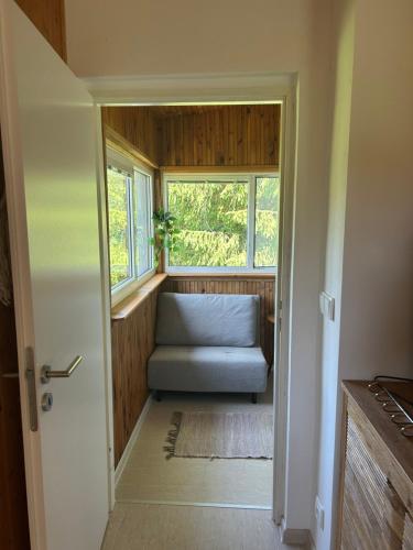 a room with a couch and a window at Chata na soutoku in Kestřany