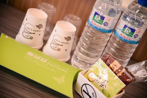 a group of bottles of water sitting on a table at KIWI-Taichung Station Branch 1 in Taichung