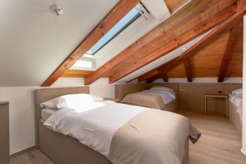 Cama o camas de una habitación en H - Suites