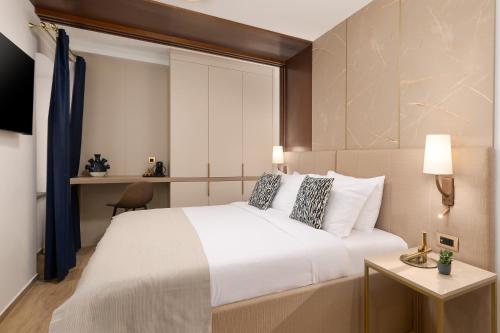 Cama o camas de una habitación en H - Suites