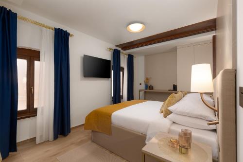 Cama o camas de una habitación en H - Suites