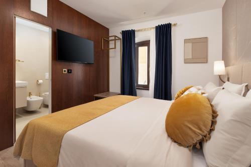 Cama o camas de una habitación en H - Suites