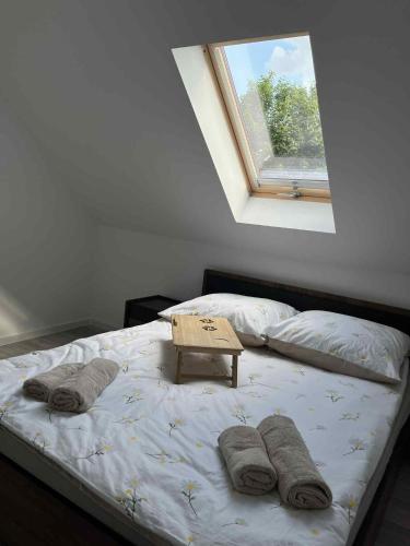 a bedroom with a bed with a sign on it at Bądź blisko in Jurków