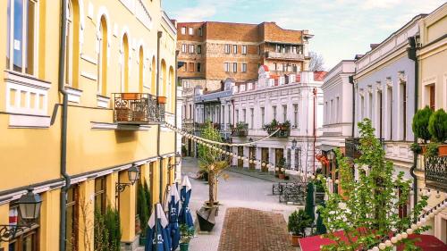 an empty street in a city with buildings at Apartment in Agmashenebeli in Tbilisi City
