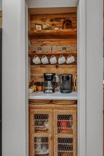 a walk in pantry with wooden cabinets and a stove at Ma-ple Haven --Wifi, Fireplace, Deck, Fire Pit, Family Friendly, Game Room, Pool Access in Berkeley Springs