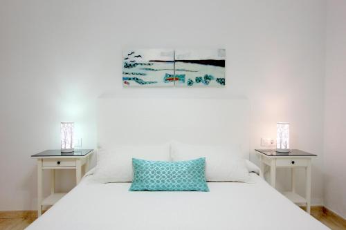 Postel nebo postele na pokoji v ubytování Apart ConiL Benavent