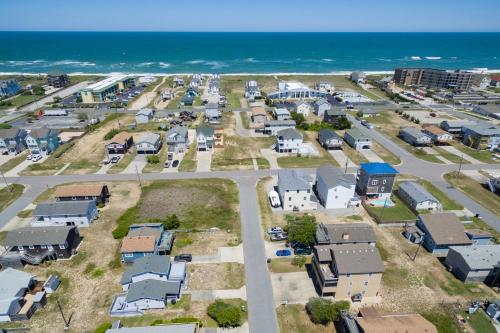 an aerial view of a town with the ocean at Blackbird Inn in Kill Devil Hills