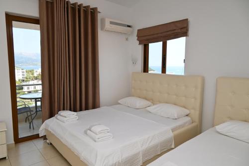 Postel nebo postele na pokoji v ubytování Hotel Marku