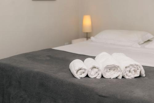 Katil atau katil-katil dalam bilik di Flat Majestique - A poucos metros do centro