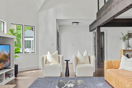 a living room with two chairs and a couch at Living My Best Life in Union Pier