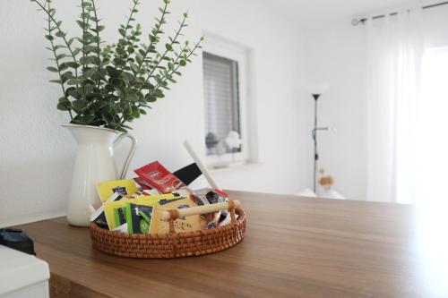a basket of toys sitting on a table with a vase at Villa Maris in Veli Iž