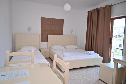 Postel nebo postele na pokoji v ubytování Hotel Marku
