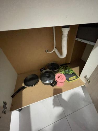 a box with two pots and pans on top of it at VivaVida boungavilli 01 in Sinop