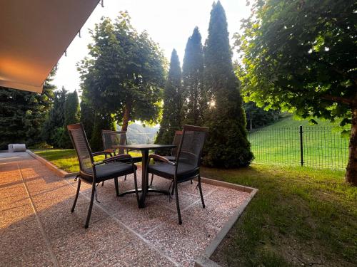 a table and chairs sitting on a patio at Dih narave in Stahovica