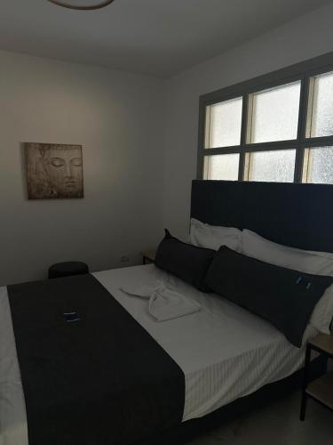 Ένα ή περισσότερα κρεβάτια σε δωμάτιο στο MM Apartments
