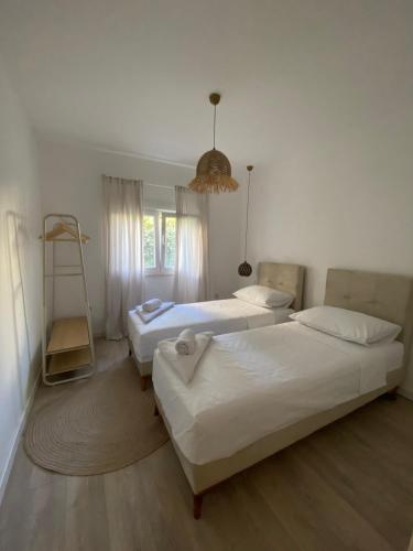 a bedroom with two beds and a ladder in it at Boka Bliss in Zelenika