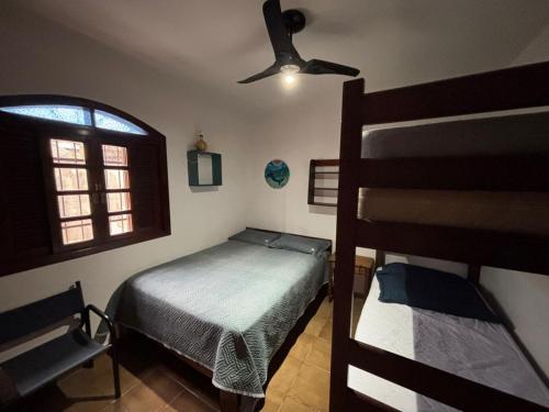 Voodi või voodid majutusasutuse Casa Itagua proximo a praia toas