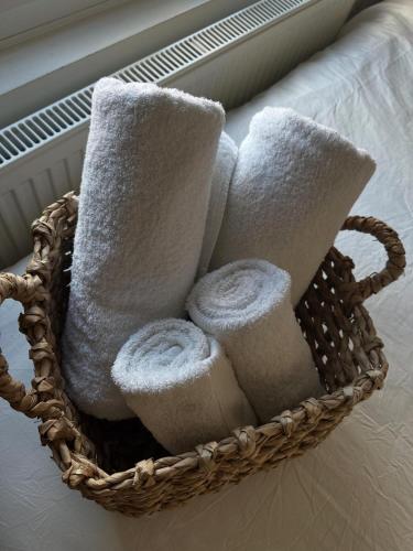 a basket filled with towels on a window sill at The Hideaway Haven in Belvedere