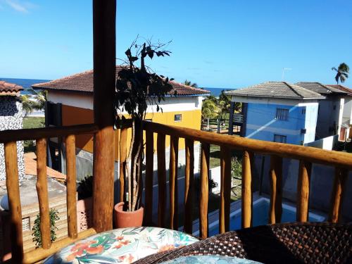 a view from the balcony of a house at Chalé Pé na Areia e Piscina Privativa em Barra do Jacuípe in Camaçari