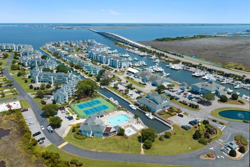 an aerial view of a marina with boats and condos at Duck Crossing in Manteo
