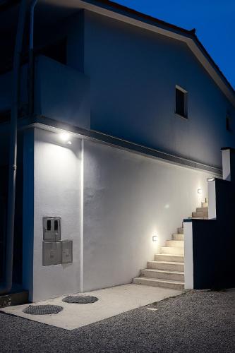a building with a door with a set of stairs at Studio Vesna & Žan in Koper