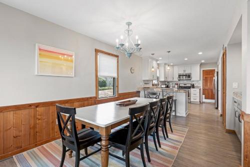 a kitchen and dining room with a table and chairs at Endless Summer in Sanderling