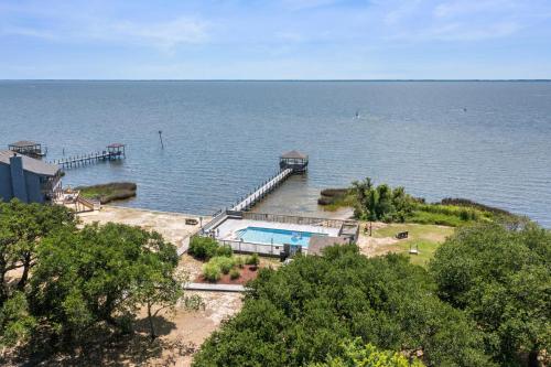 a dock in the middle of a large body of water at Endless Summer in Sanderling