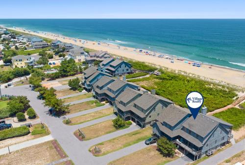 an aerial view of a house and a beach at Endless Summer in Sanderling