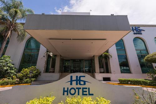 a hotel sign in front of a building at HG Hotel in Guadalajara