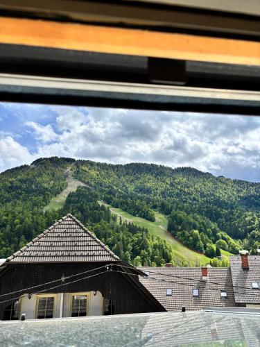 a view of a mountain from a window at Apartments Belopeški Dvori in Kranjska Gora