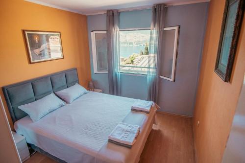 Postel nebo postele na pokoji v ubytování Apartments "Belle Vue"