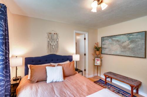 a bedroom with a large bed with a blue headboard at Hike On-Site Mountain-View Hideaway in Durango in Durango