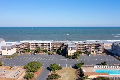 an aerial view of an apartment complex next to the ocean at Golden Strand Unit C3 in Kill Devil Hills