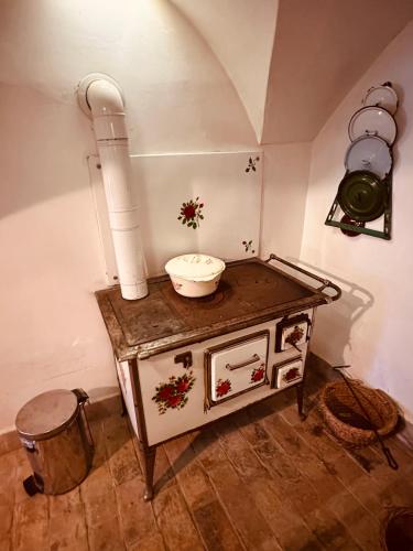 a room with a sink and a bowl on a table at Kusper Vendégház 1846 in Bükkzsérc