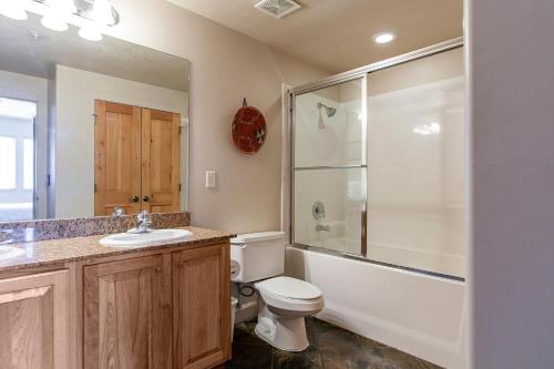 a bathroom with a toilet and a sink and a shower at Crestview Condominiums by All Seasons Resort Lodging in Park City