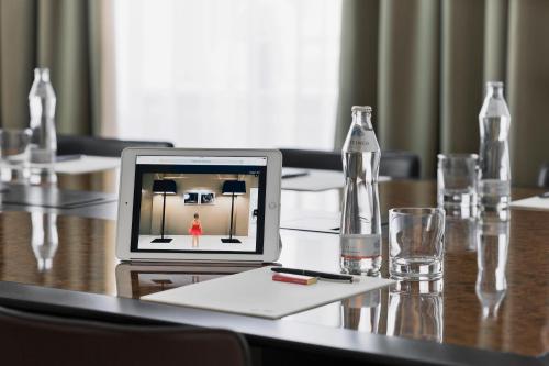 a laptop computer sitting on top of a table at The Harmonie Vienna, BW Premier Collection in Vienna