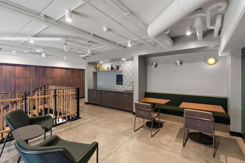 a room with a table and chairs and a staircase at W513 Cozy & Chic 1Bd In Downtown Minneapolis, Minutes From Minneapolis Convention Center & US Bank Arena in Minneapolis