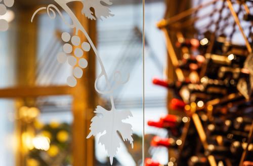 a bunch of wine bottles in a wine cellar at Ramada by Wyndham Baden Hotel du Parc in Baden