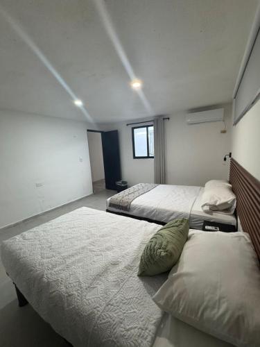 Postel nebo postele na pokoji v ubytování Margaritas Cincuenta